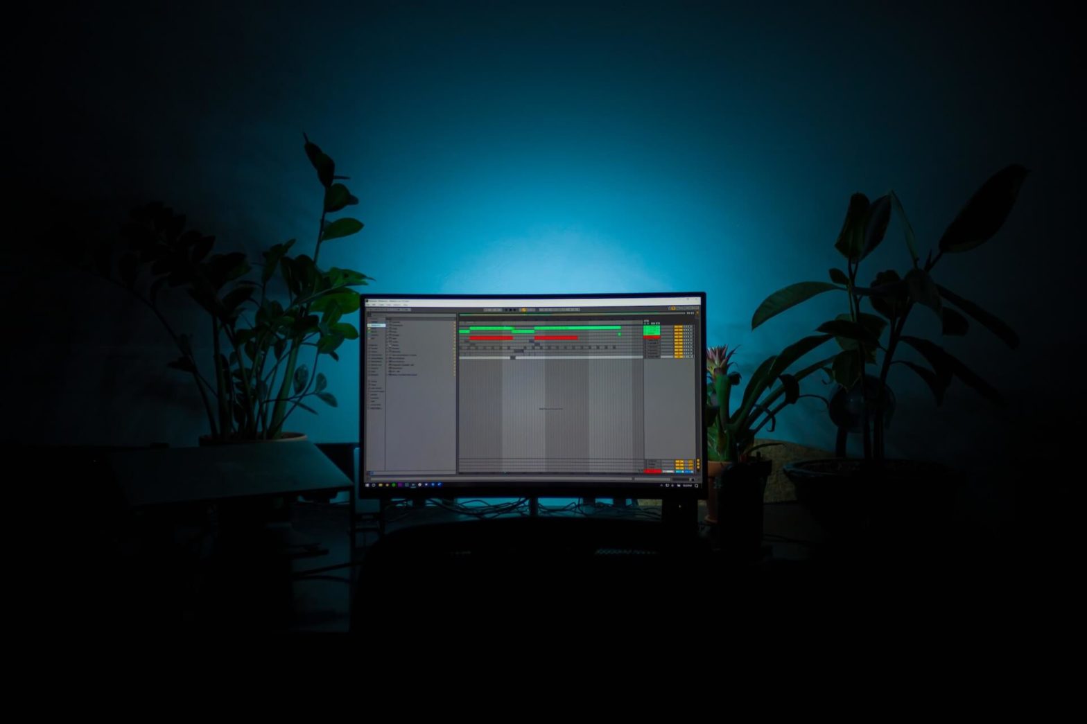 a picture of a widescreen curved monitor with the gray ableton session screen open